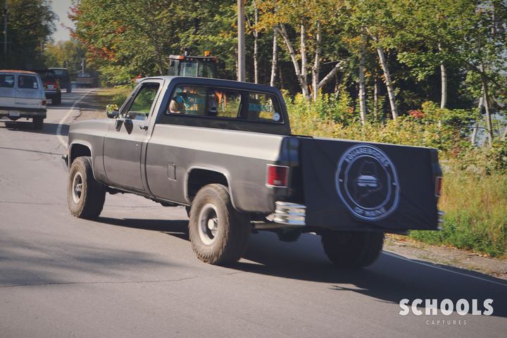 Blue-gray pickup with spare